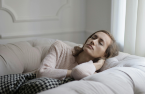 Can a Vagus Nerve Reset Help You Sleep Better? sleeping peacefully in a cozy bed after a vagus nerve reset