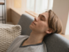 5 Simple Ways to Do a Vagus Nerve Reset at Home Young man relaxing on sofa for stress relief