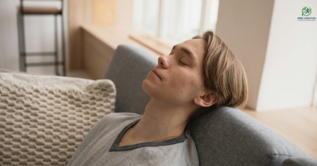 Boy relaxing breathing Young man relaxing on sofa for stress relief