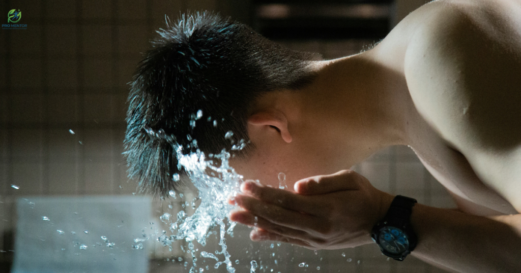 Man splashing cold water on face for vagus nerve reset