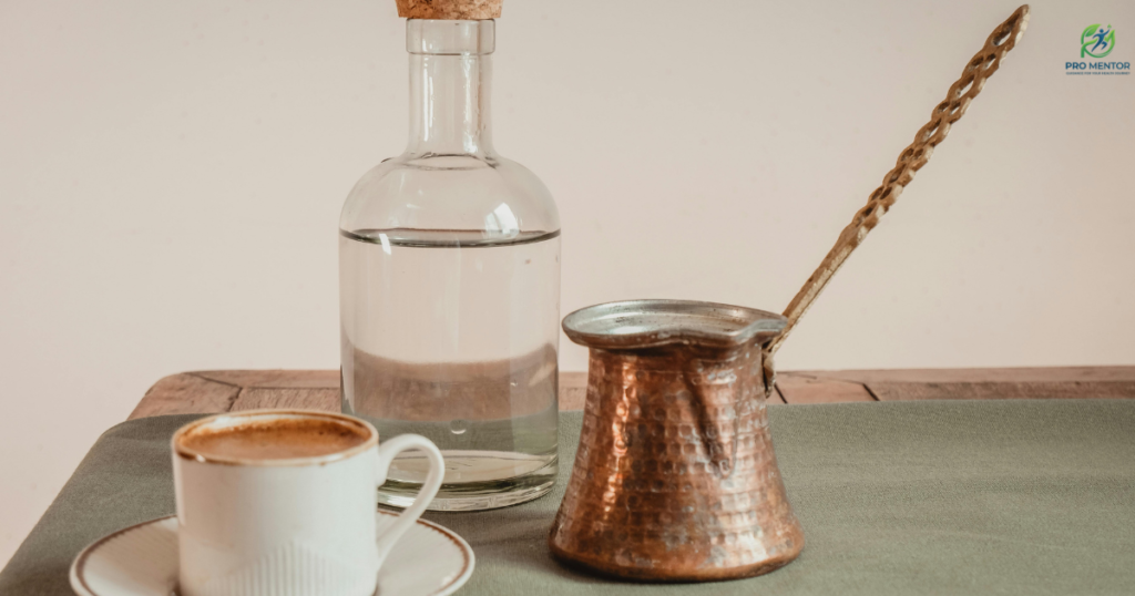 A cup of coffee on a table representing the 90-minute caffeine rule for gut health